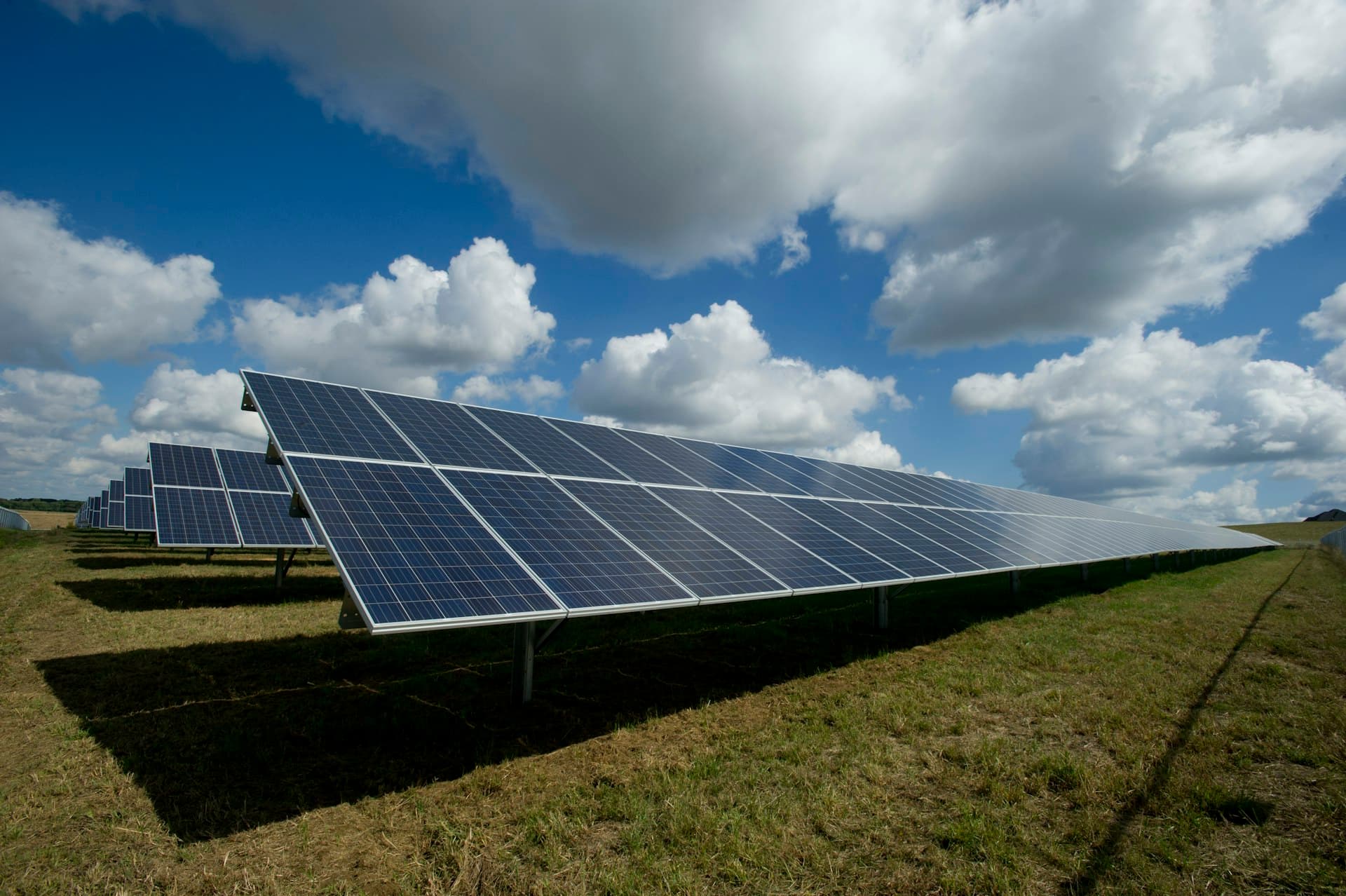 Solar panels under a bright Indian sky